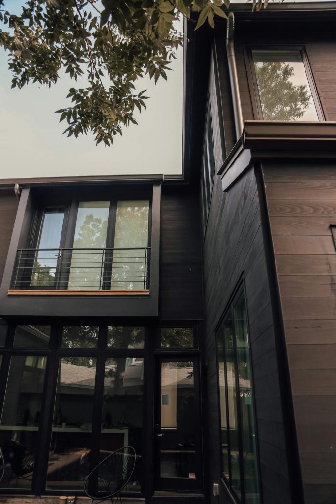 Wood exterior clad contemporary apartment building.